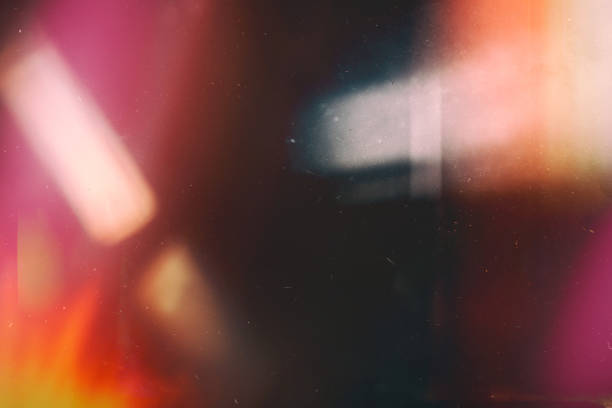 Dark frame streaked with pink and amber light leaks