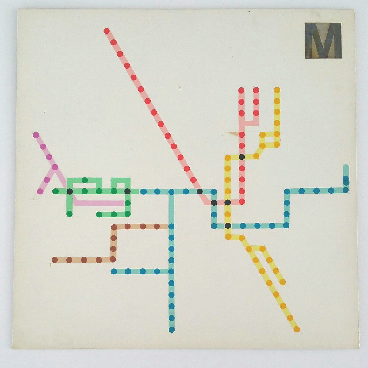 Metro map drawn as coloured beaded dot lines on cream board
