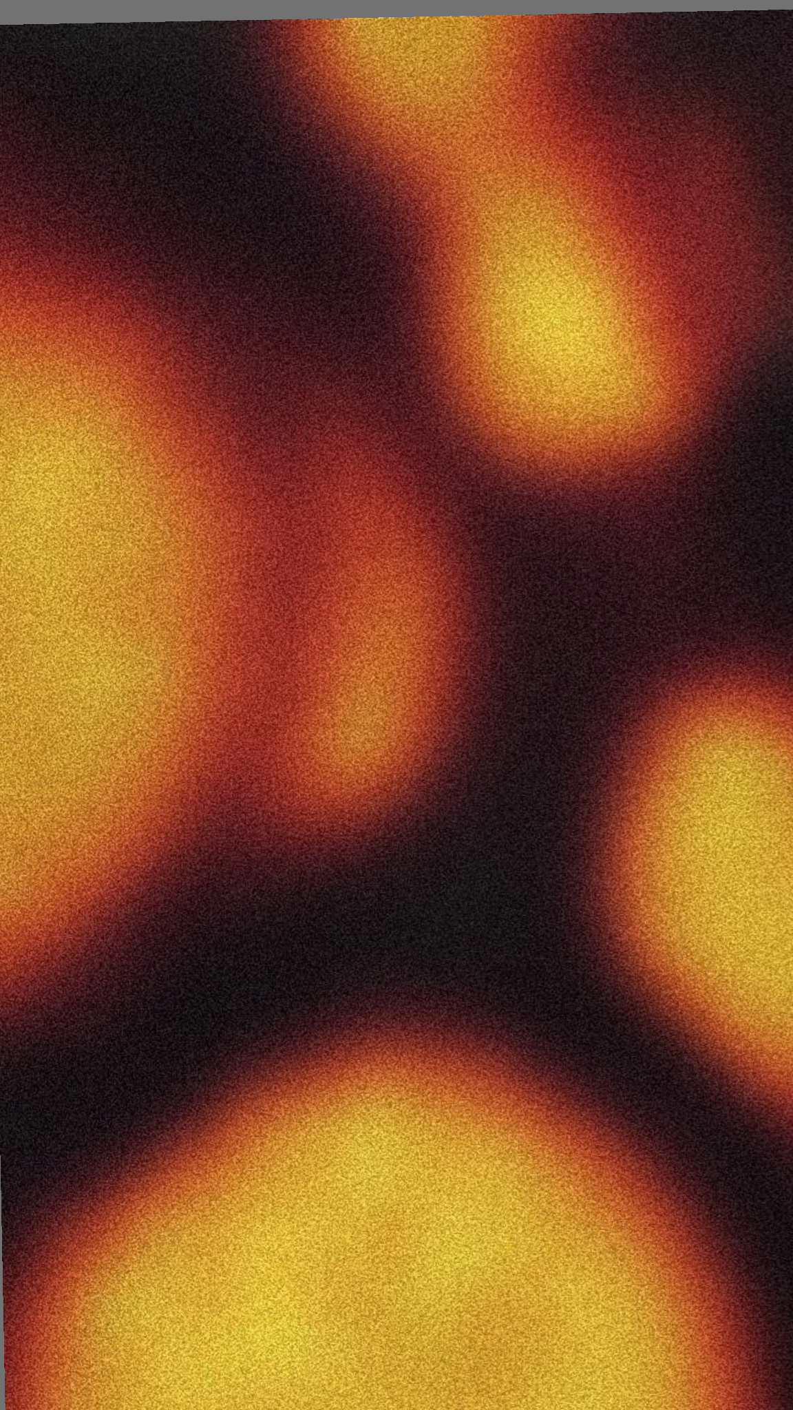 Soft out-of-focus orbs of orange and amber fire glowing on near-black