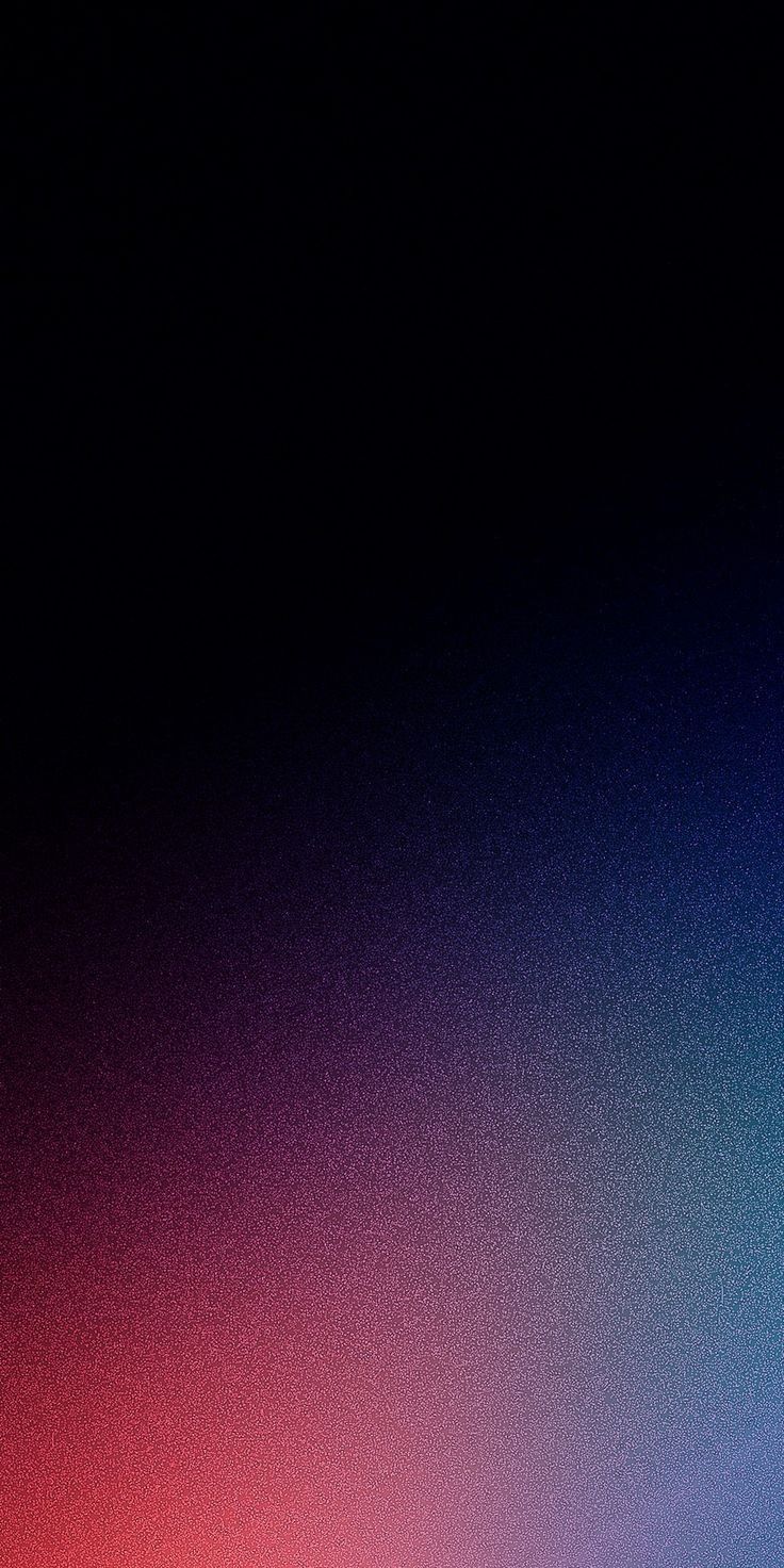 Grainy gradient sinking from black into deep red, magenta and blue
