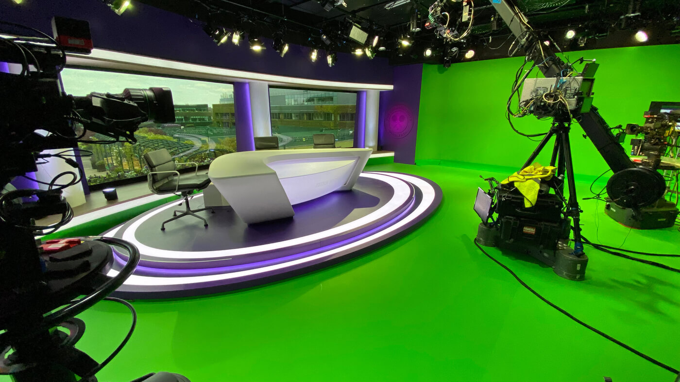 BBC Sport Wimbledon virtual production studio with curved desk and robotic arm